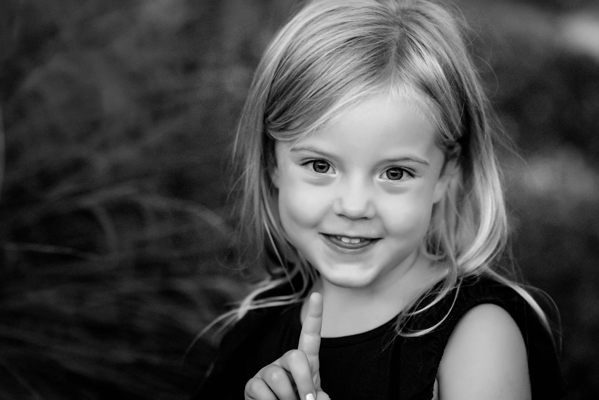 Beautiful black and white photo of little girl smiling during her photosession
